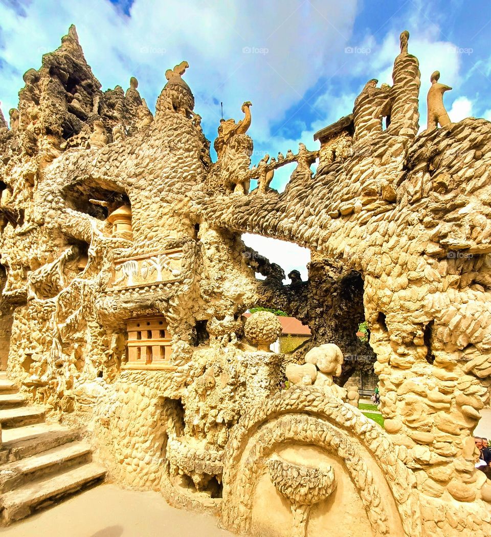 Palais Idéal du Facteur Cheval. Whimsical and intricate structure built by Ferdinand Cheval, a postman, in Hauterives, France. The palace is characterized by its eclectic and fantastical architecture, constructed from Stones and natural materials.