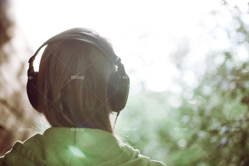 Girl with headphones listening to music