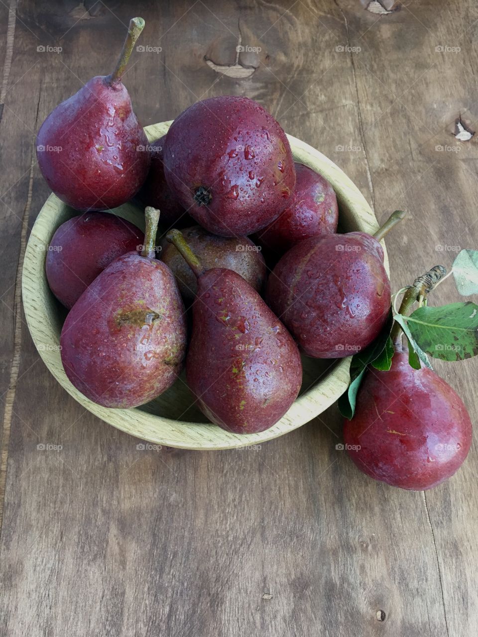 Red pear on the wooden table