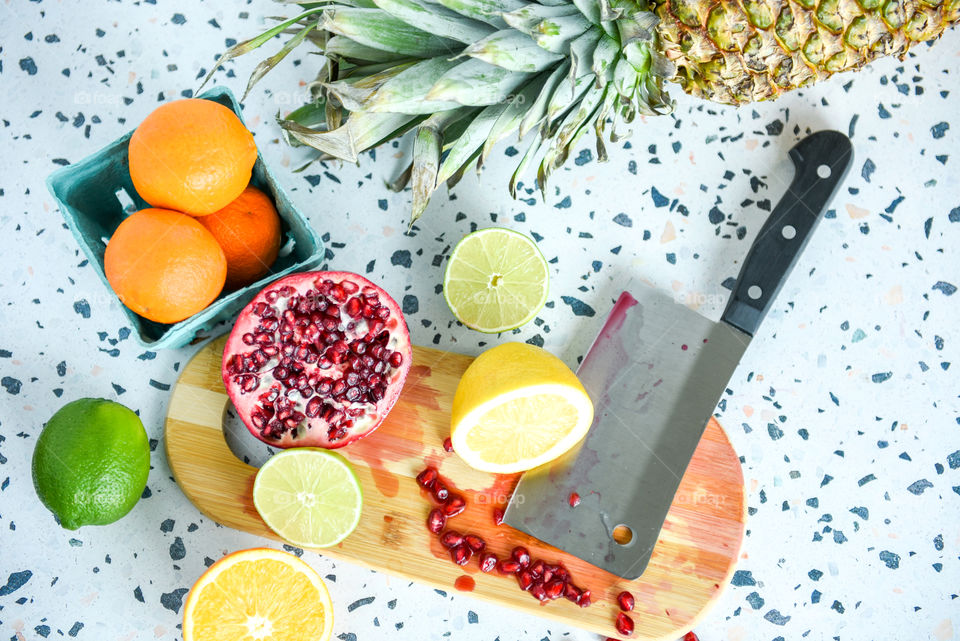 Flat lay of chopped fruit on a cutting board 