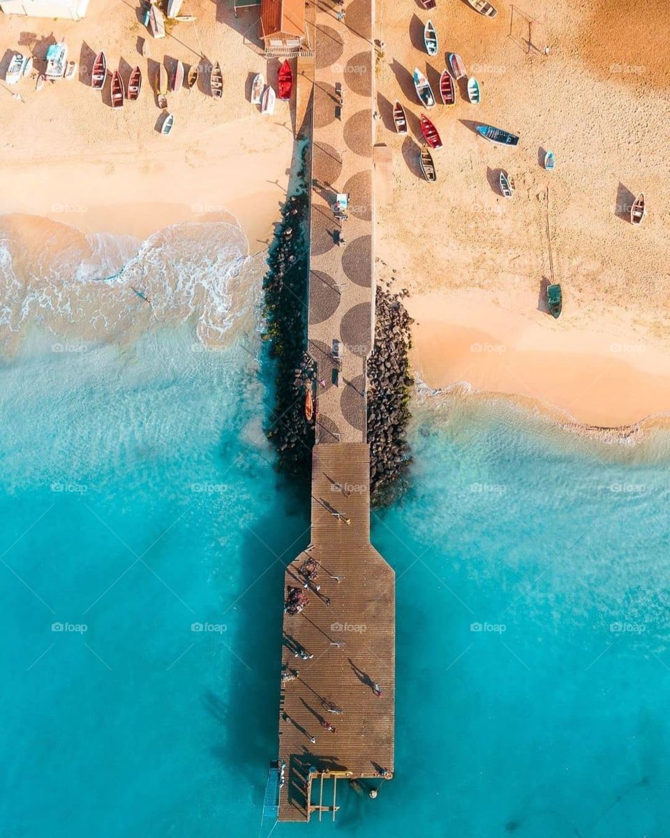 A sea side shore with many boats