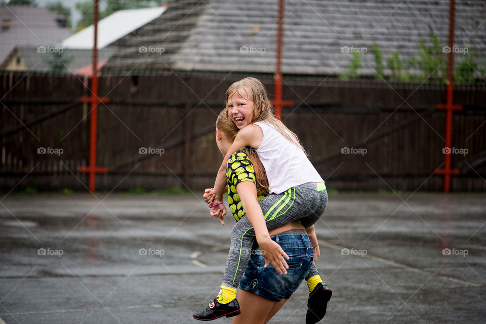 Happy girls in the rain