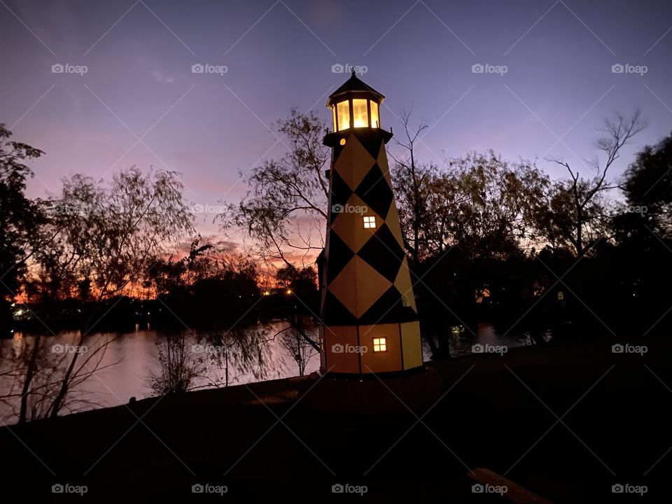 Reflections of nearby RVS with seasonal lighting against tower make for a beautiful setting along with Night. 