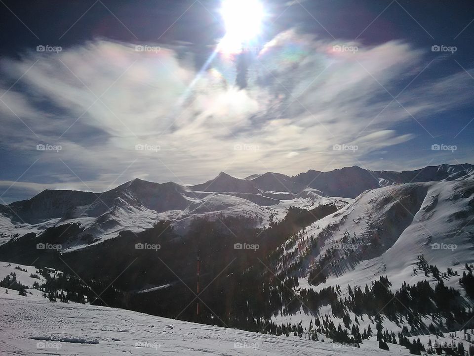 Sunshine n Clouds. Lovely shot I captured while snowboarding on some mountain in Colorado