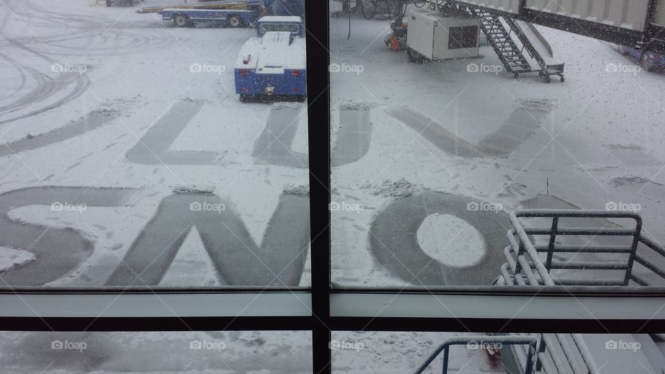 We luv (love) snow.. Written onto tarmac while waiting for a Southwest flight at DIA on February 21, 2015