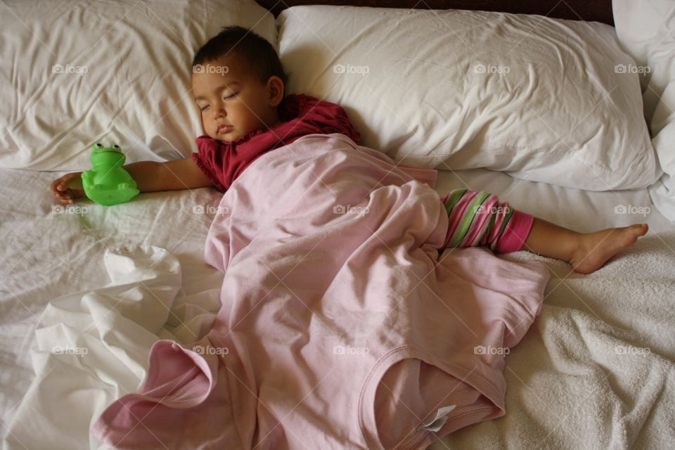 Cute baby sleeping on bed