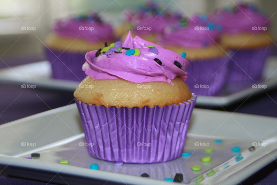 Purple cupcakes with sprinkles 