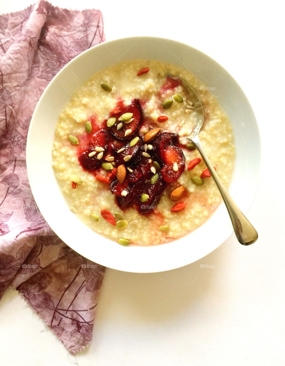 Oats with stewed plums and seeds
