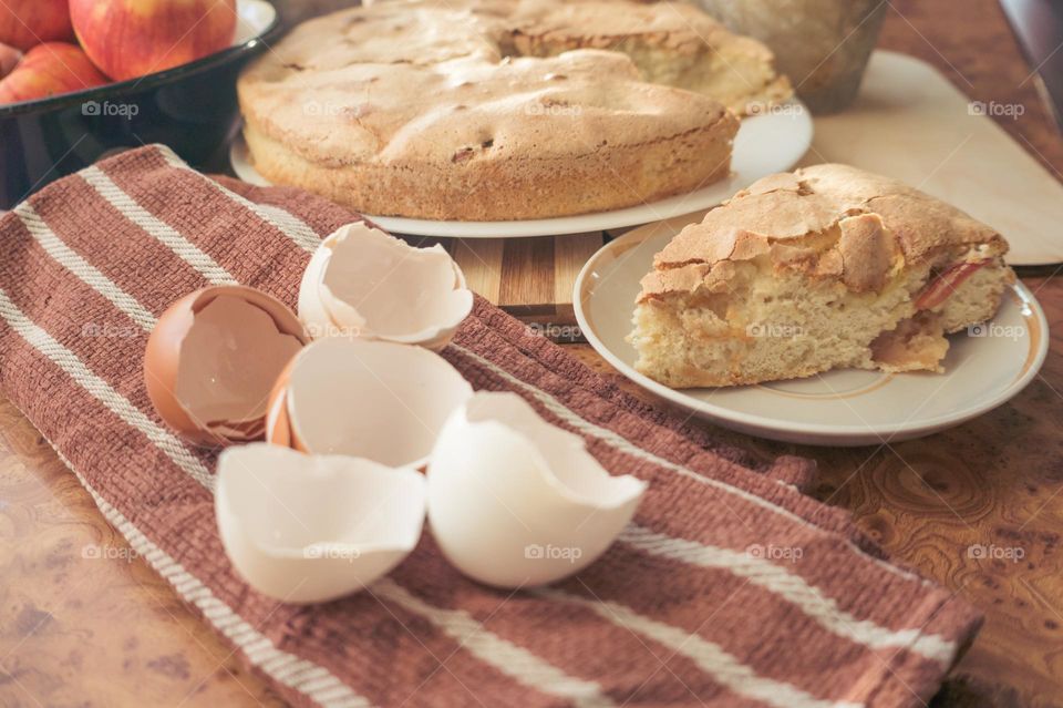 Making homemade puffed apple pie with eggs, sugar and flour.