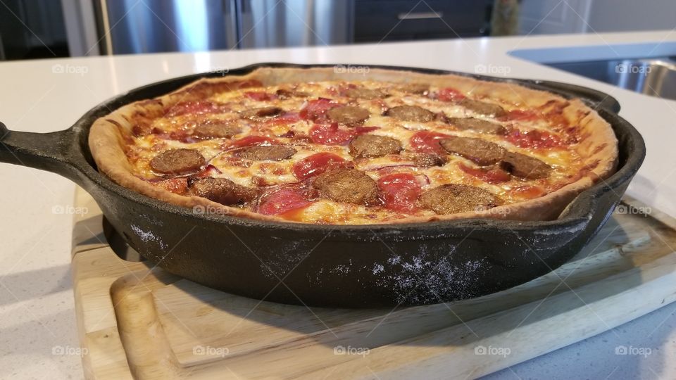 first attempt at deep dish pizza in a cast iron