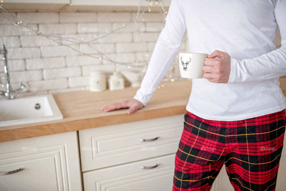 cup of coffee in a cozy festive Christmas atmosphere