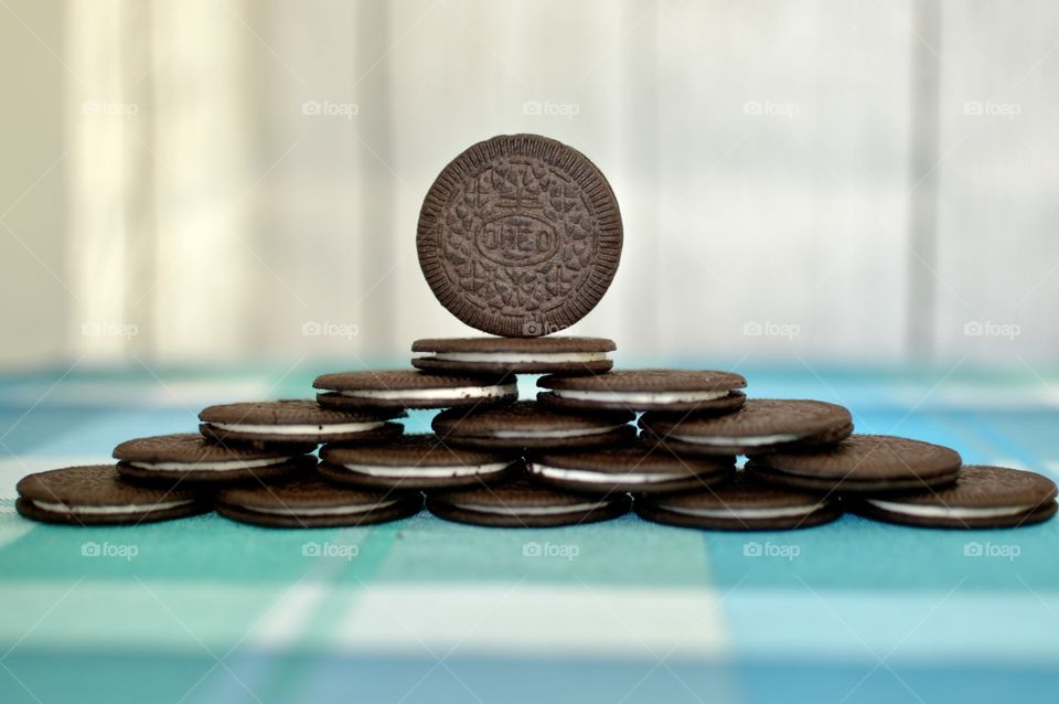 Oreo cookie thins on a white and light blue background 