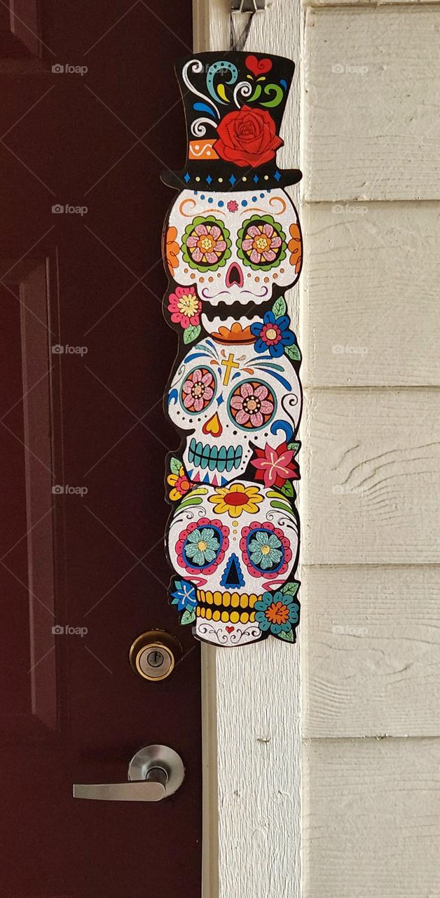 colorful Day of the dead sugar skulls decoration on the outside of an apartment in Oregon