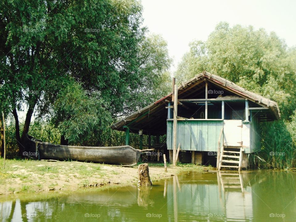 Hut and boat near the water