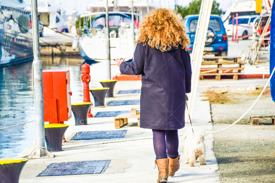 Woman At The Seaside Walking The Dog
