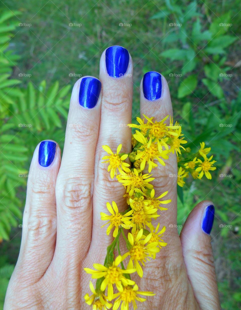 woman manicure and flowers