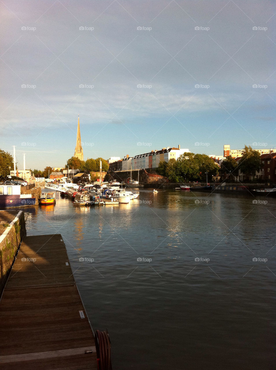 sky boats buildings river by christianam