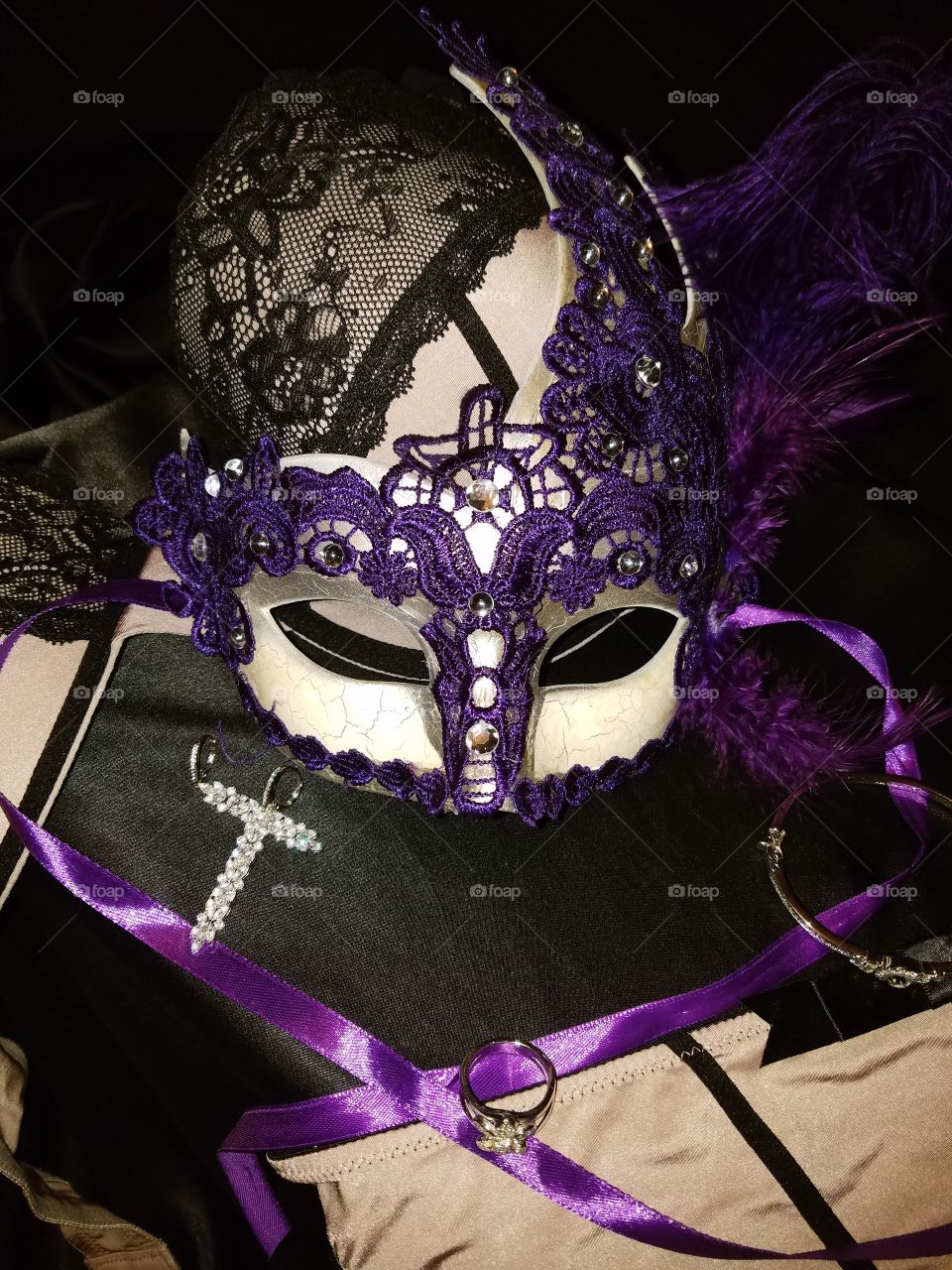purple laced Mardi Gras mask with purple feather and purple satin ribbons. mob lingerie with black accent and Diamond Jewelry earrings ,fleur-de-lis diamond ring and bracelet