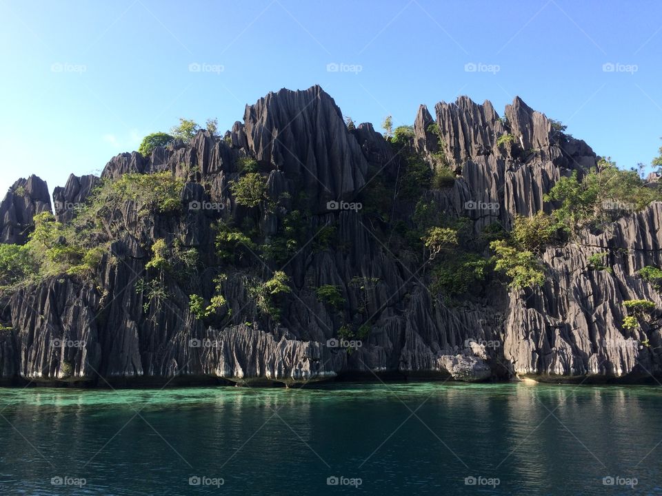 Scenic view of mountain over the sea