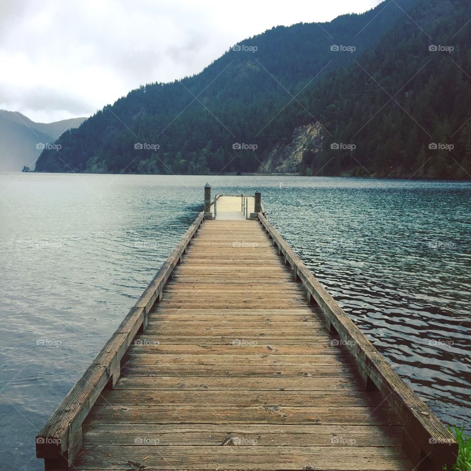 Wooden dock leading to frigid waters