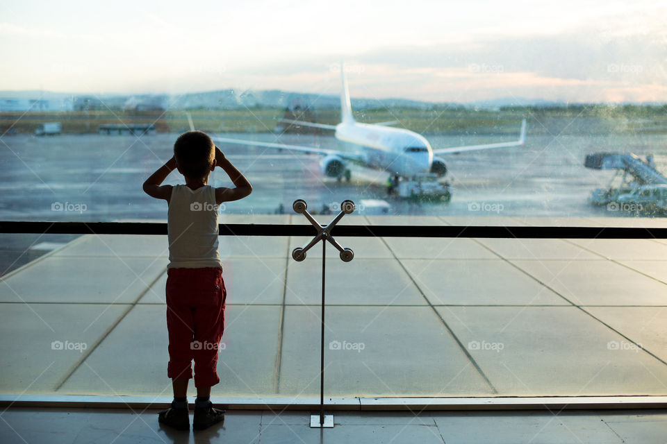 Boy standing in the airport