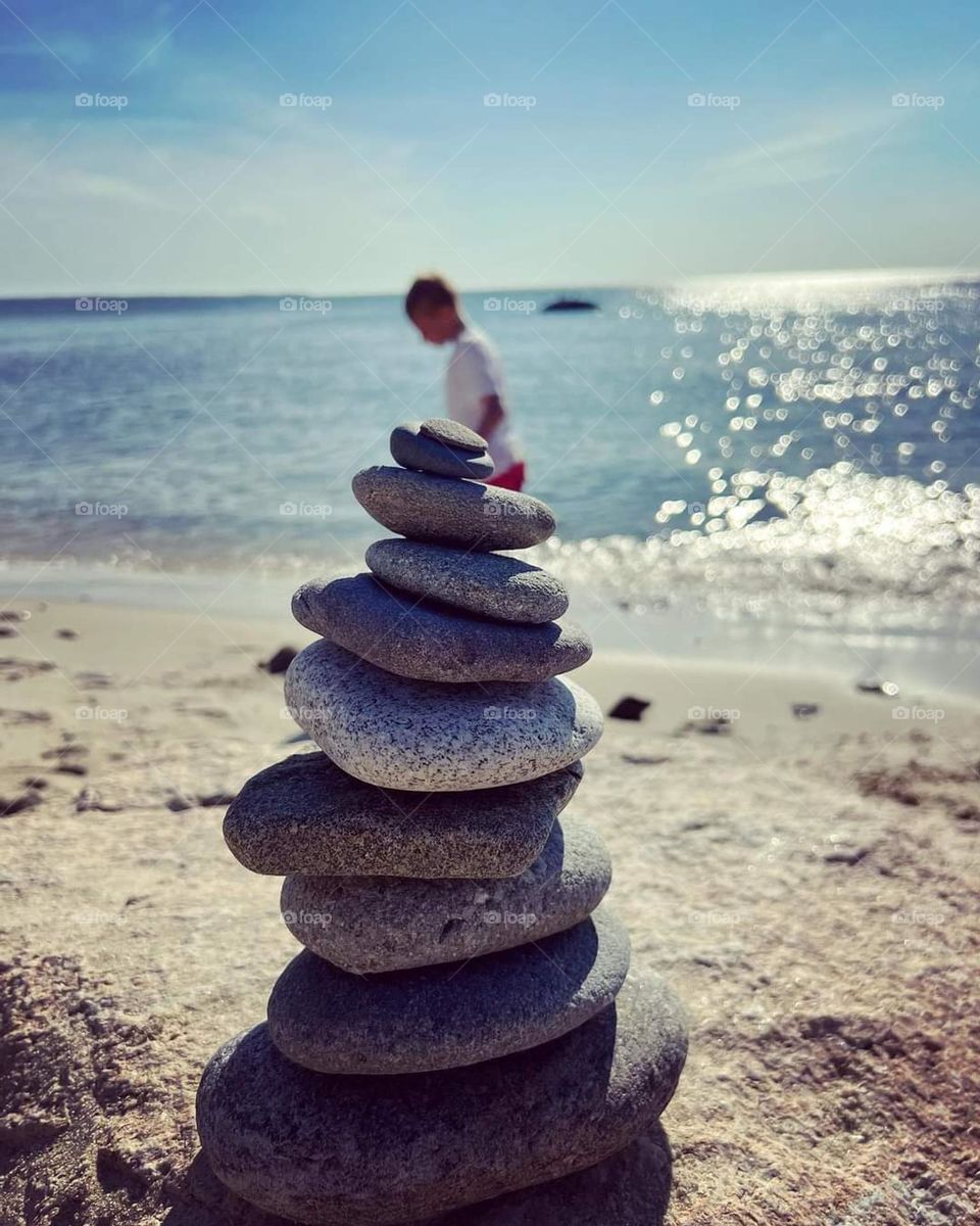 Stacking rocks on the beach