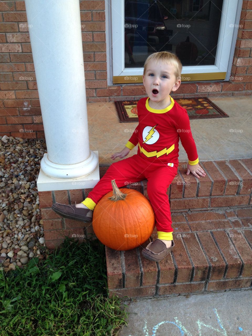 Kid flash and a pumpkin 