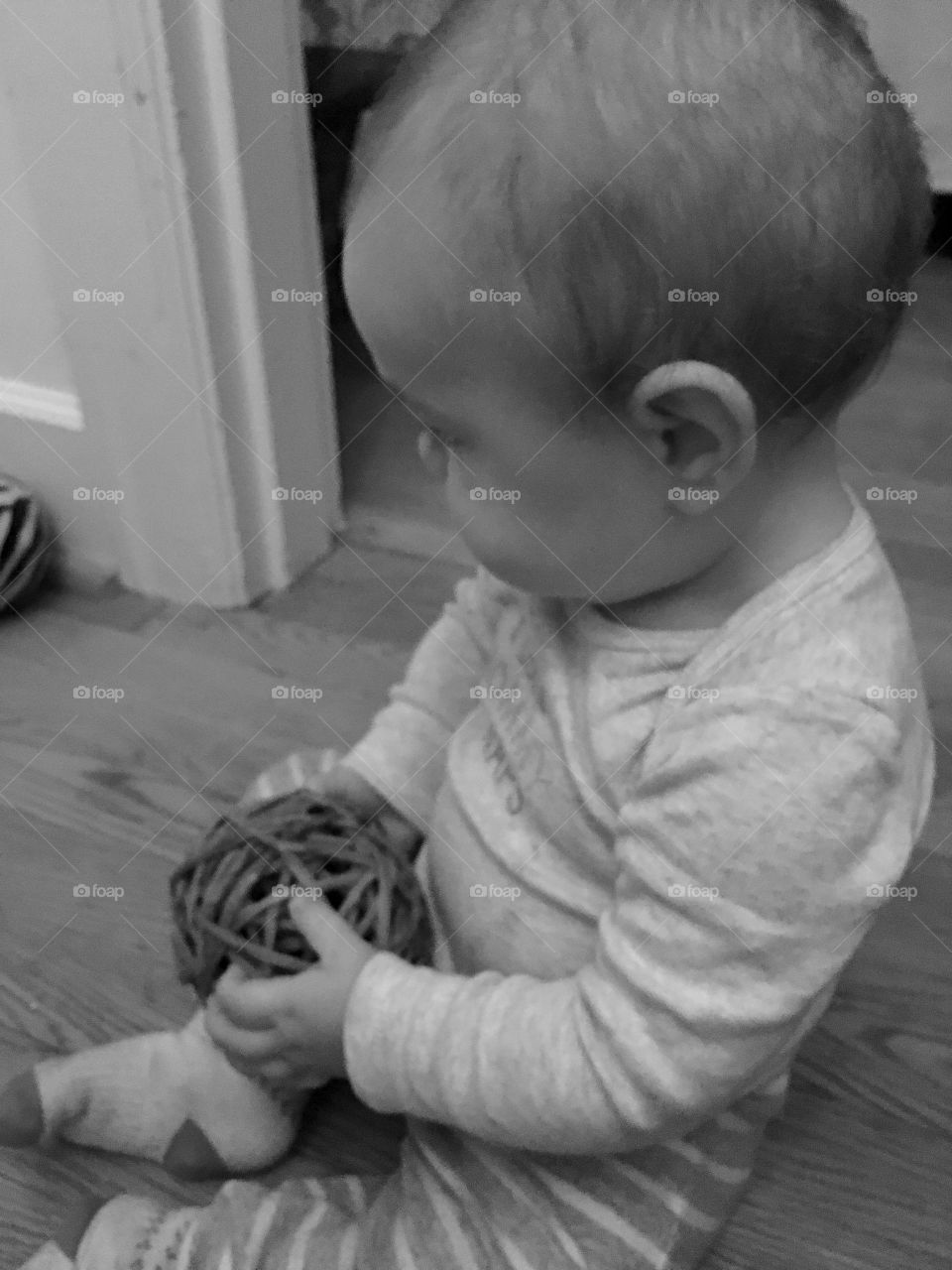 Baby with wicker ball 