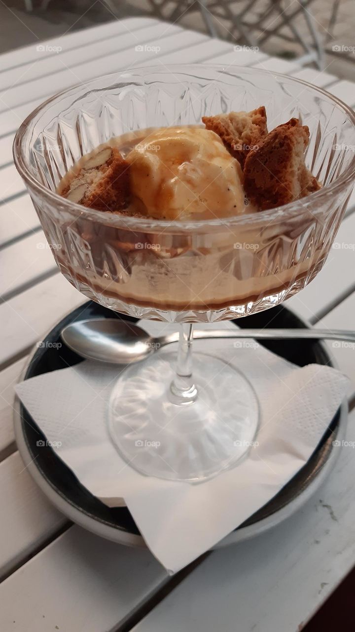 affogato Italian dessert with coffee icecream and special biscuits in trnsparent cup