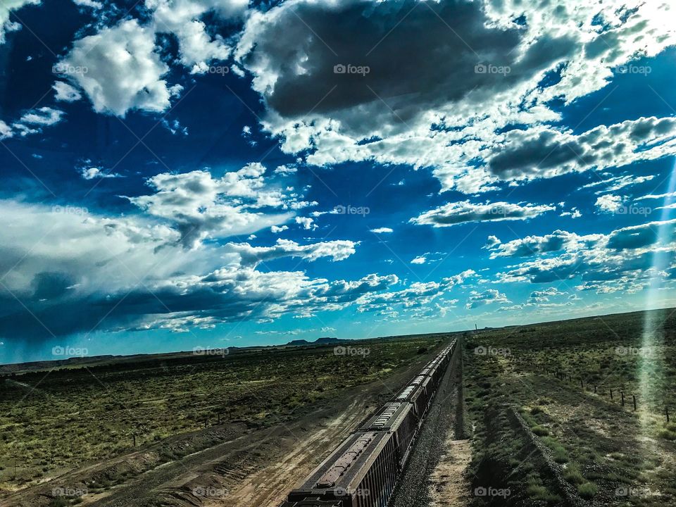 Freight train spanning out into the horizon