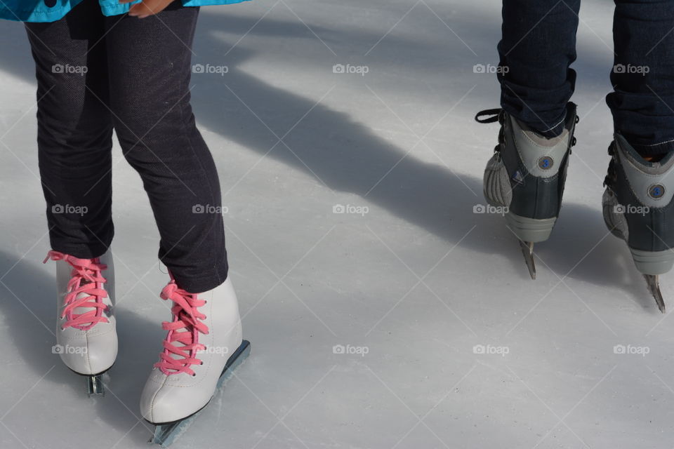 Pink shoelaces on ice skates