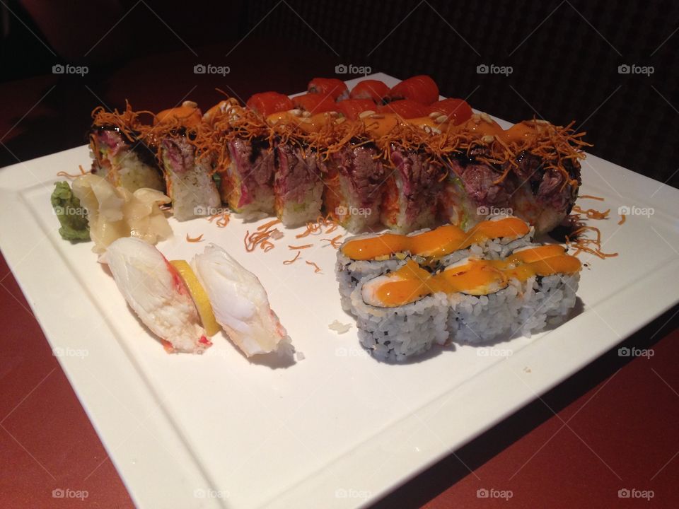 Sushi. Surf n turf roll with Alaskan king crab meat and two crunchy rolls.