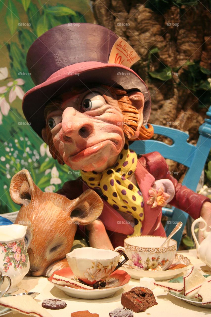 The Mad hatter during the tea party in Wonderland.