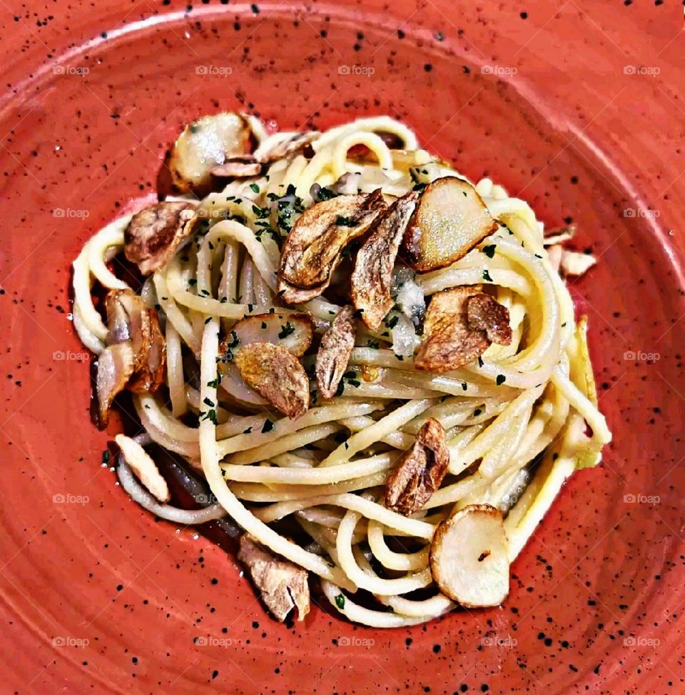Having breakfast in a clay plate in a restaurant.