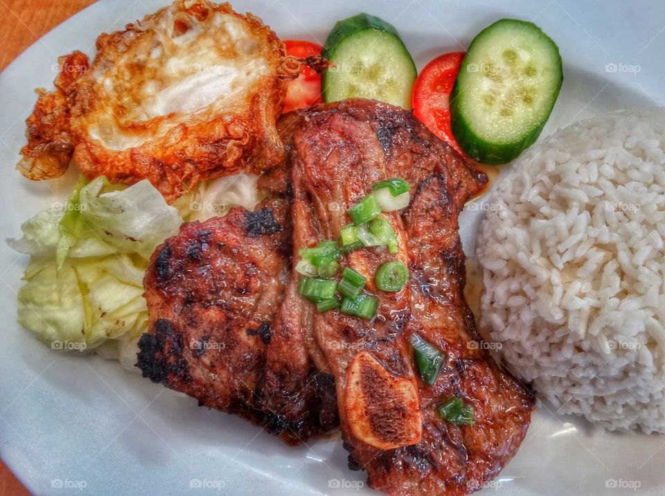 Grilled Pork Chop. Grilled Pork With Steamed White Rice And Fresh Vegetables
