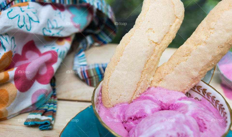 Lady fingers cookies in pink sorbet ice cream