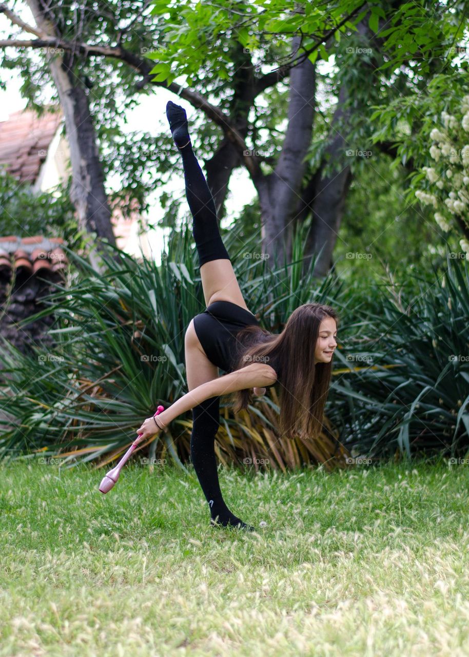 Beautiful Young Gimnast Dancing in Nature