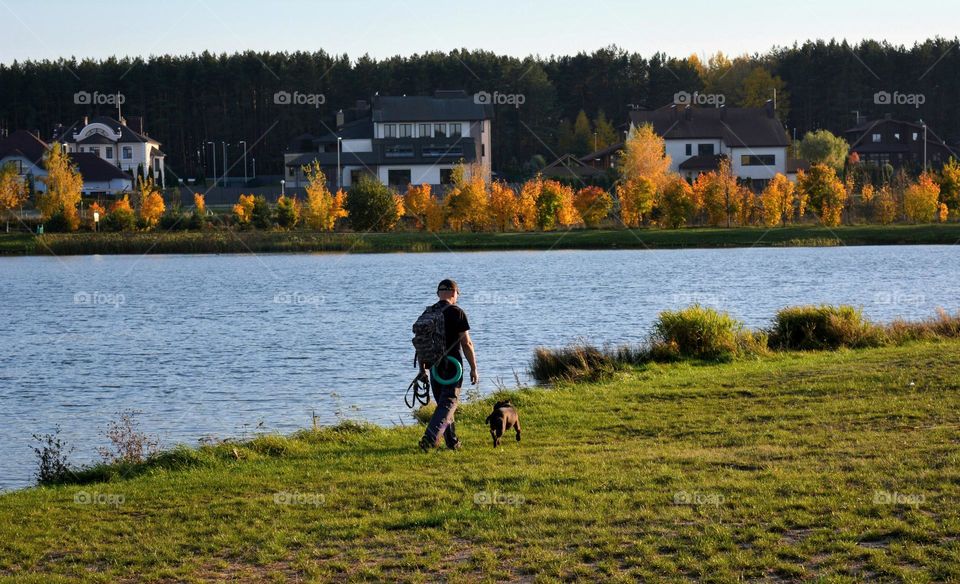 men walking with dog autumn nature landscape