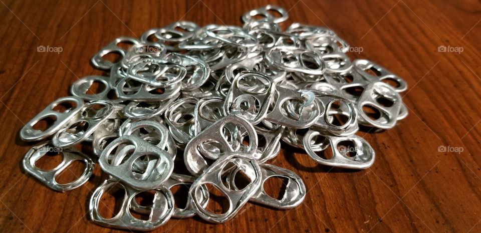 Tabs from aluminum cans of soda pop drinks