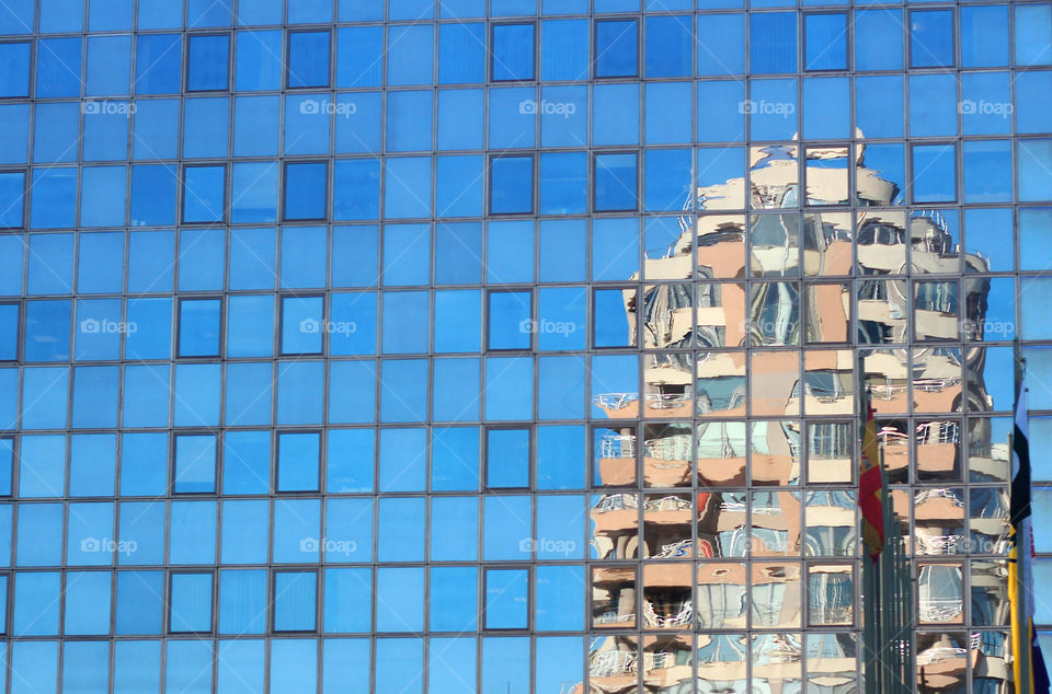 Windows reflection of another building, modern building exterior, glass material