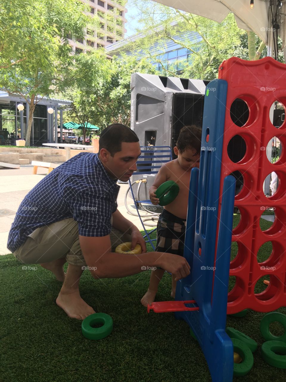 Playing giant Connect Four game.