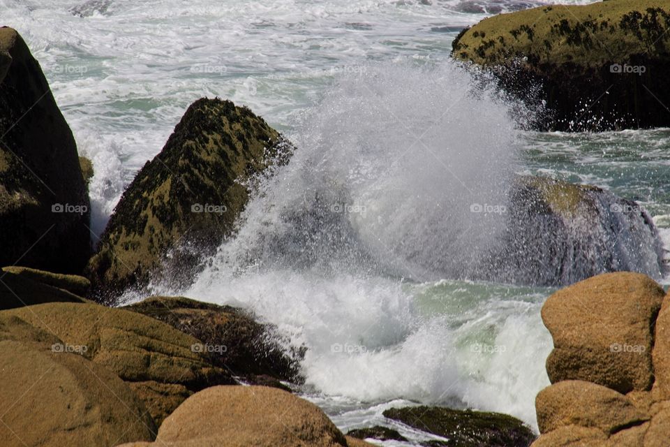 waves breaking on rocks