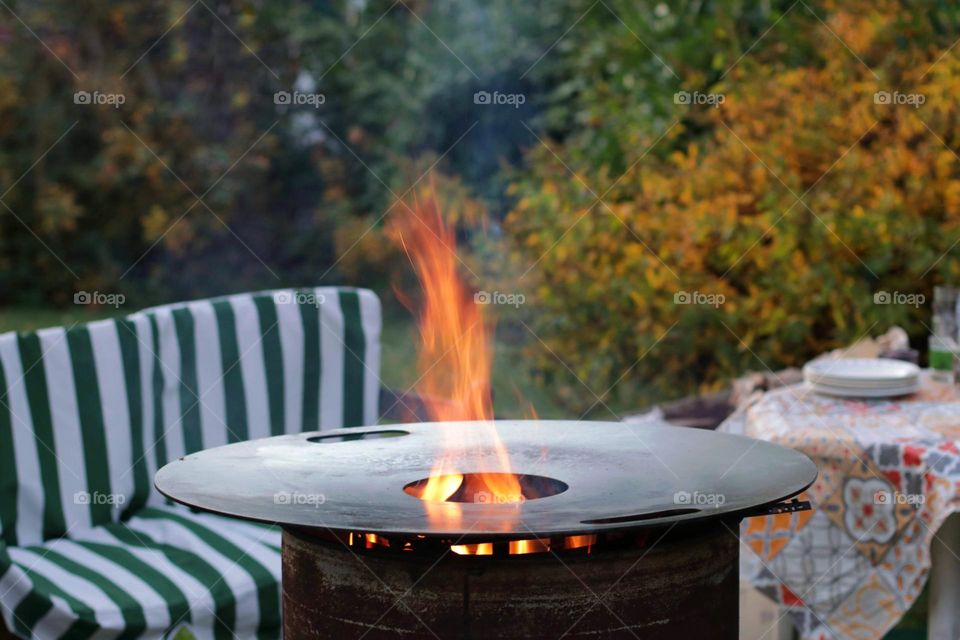 Barbecue fire in garden at autumn 