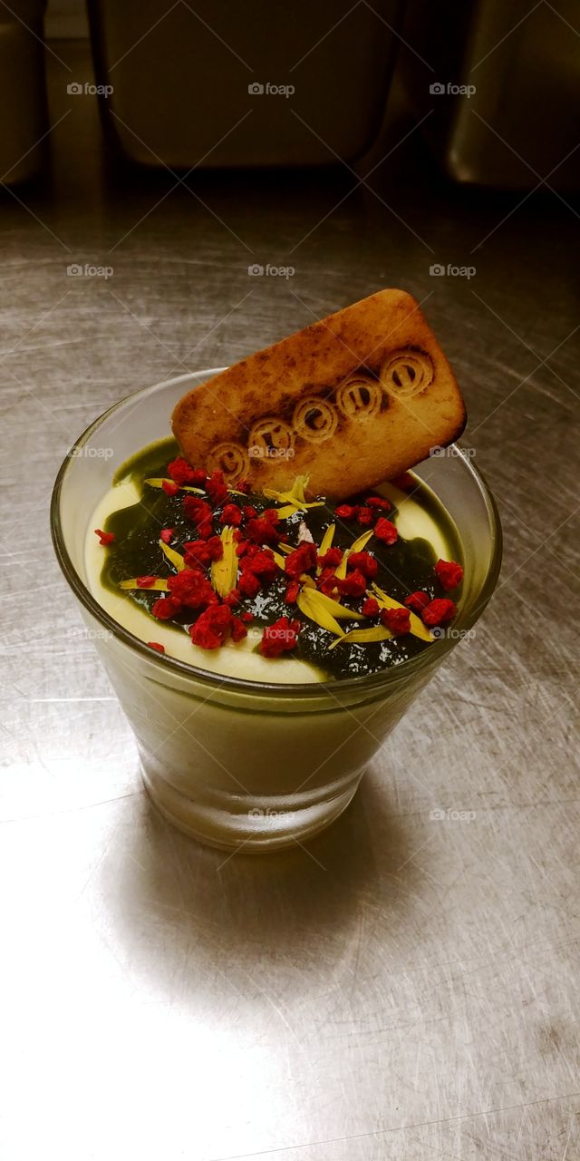 lemon mousse with olive oil cake, sweet basil sauce, dehydrated raspberries, and shortbread cookie