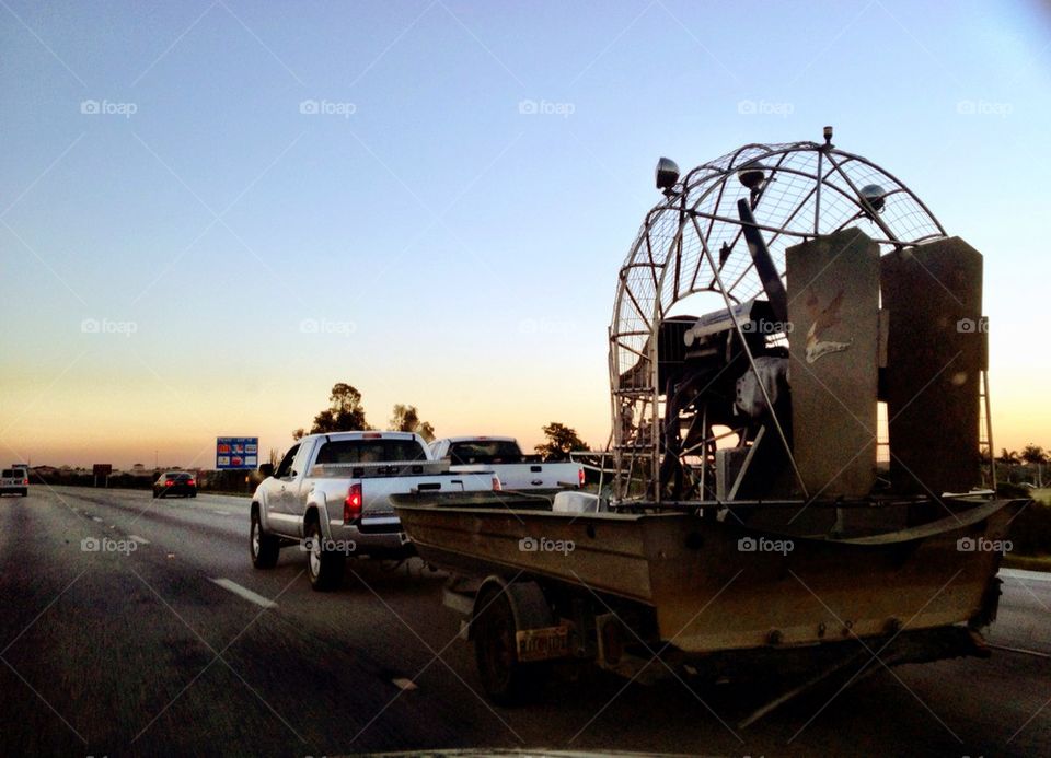 Pick up truck hauling an air boat