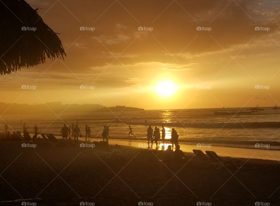 Bright sunset illuminates the beach  in Costa Rica