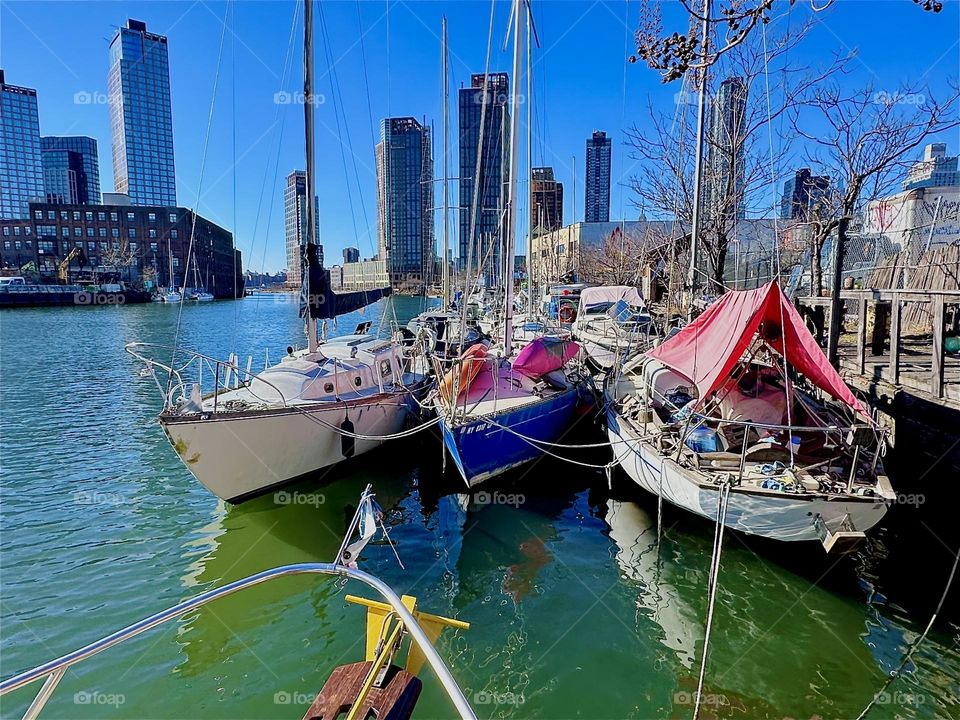 This is “Newtown Creek” by the “Pulaski Bridge” in LIC, Queens with its picturesque boats seen from aboard “Salvation”, the “28 ft 1969 Luhrs” cabin cruiser that is home to myself and my longtime partner “Timothy Trespas”. 2024. Hypnotic Productions
