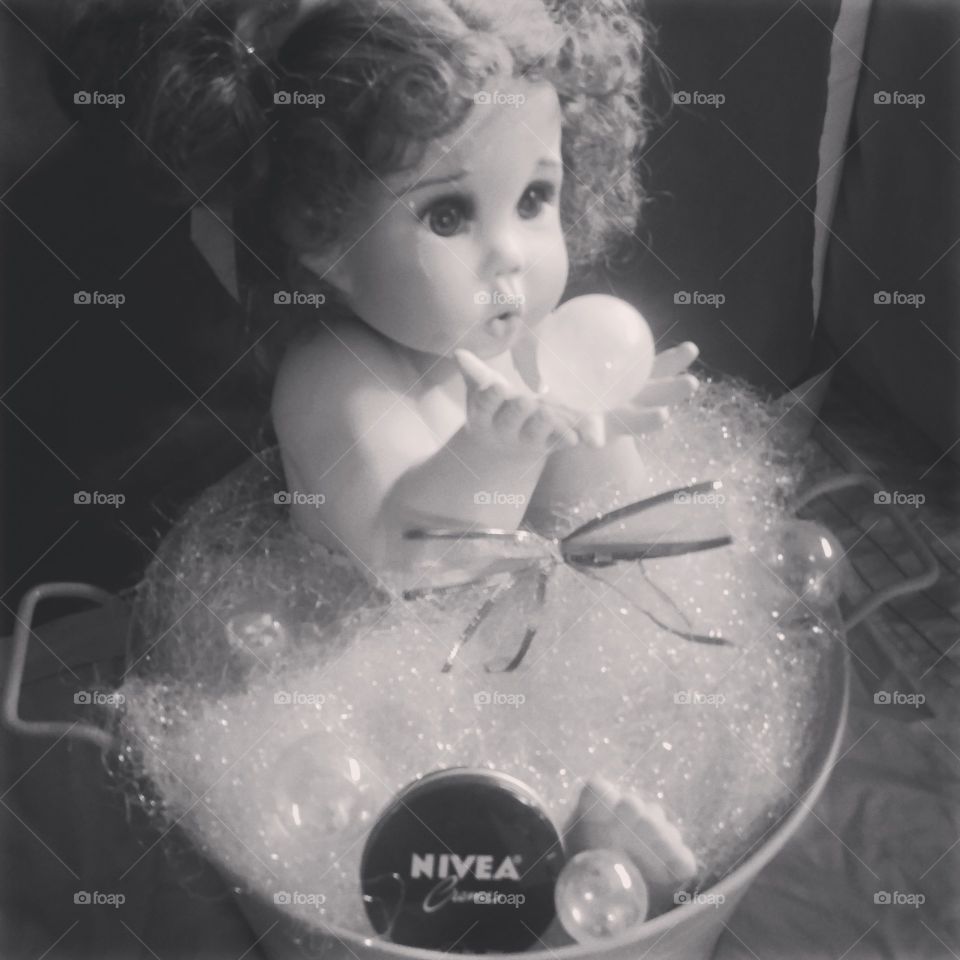 B/w bubble blowing baby