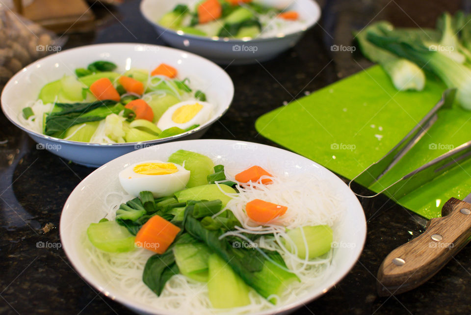 Preparing vegetable soup for lunch at home