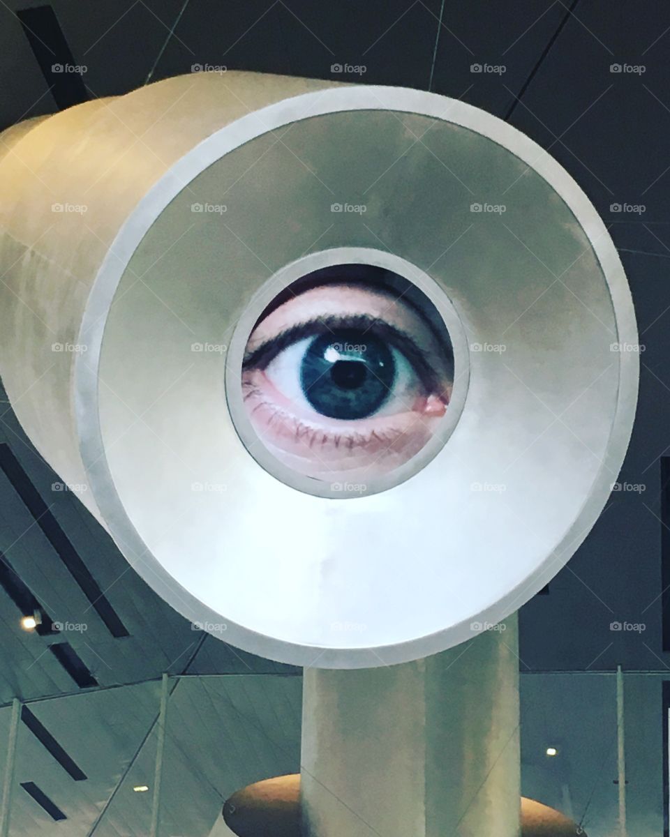 A view of an eye as it looks through a telescope. 